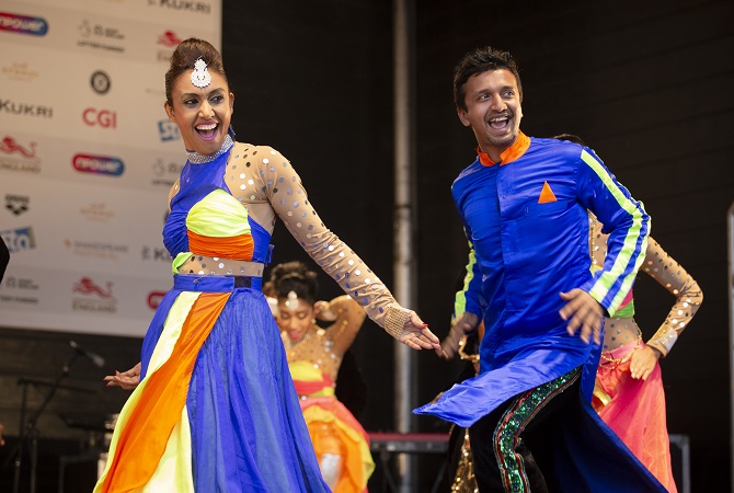 Sampad dancers wearing bright bollywood costumes
