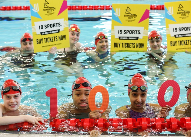 A group of young swimmers celebrate 100 days to go at the new Sandwell Aquatics Centre