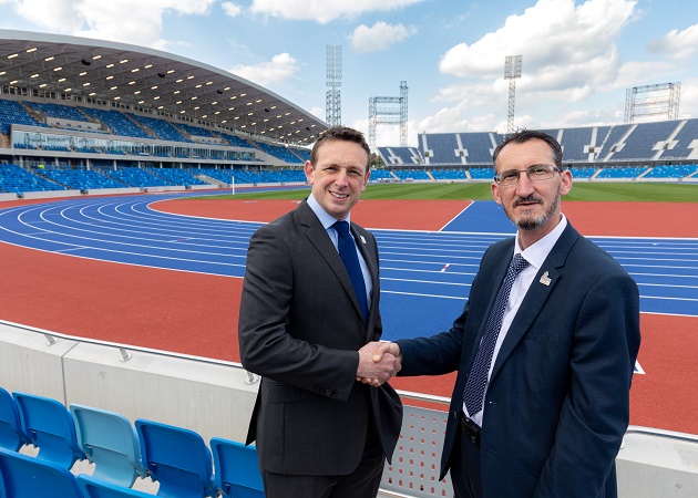 Dom Olliff, Birmingham 2022, shaking hands with Dave Wagg from Birmingham City Council at the Alexander Stadium