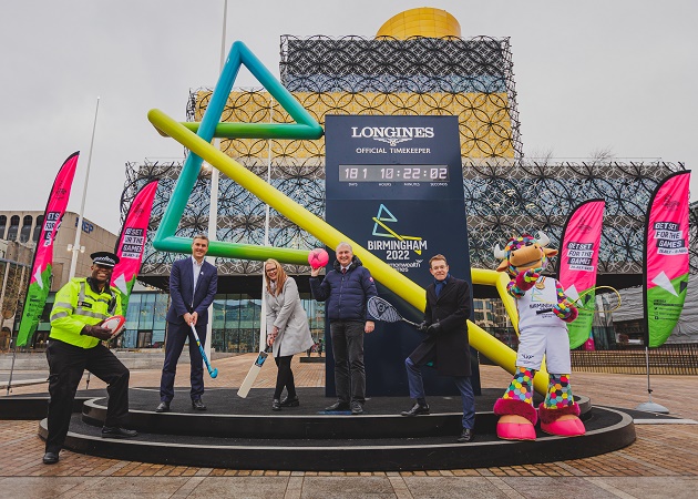 Local Games partners and Perry stand outside the Birmingham 2022 countdown clock to launch Get Set for the Games