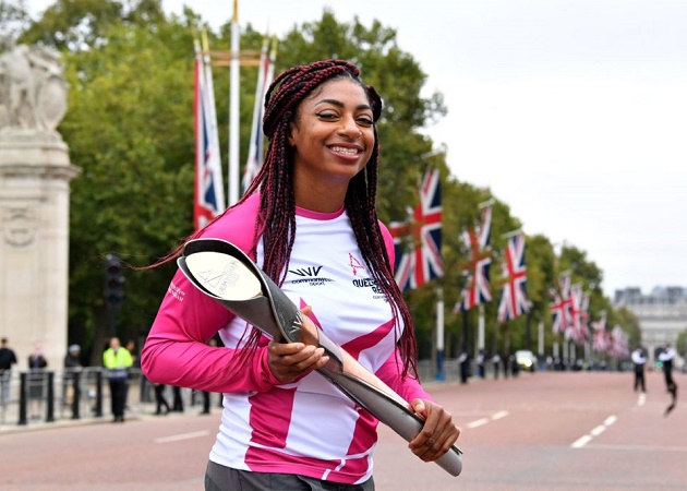 Paralympic champion Kadeena Cox holds the Queen’s Baton outside Buckingham Palace