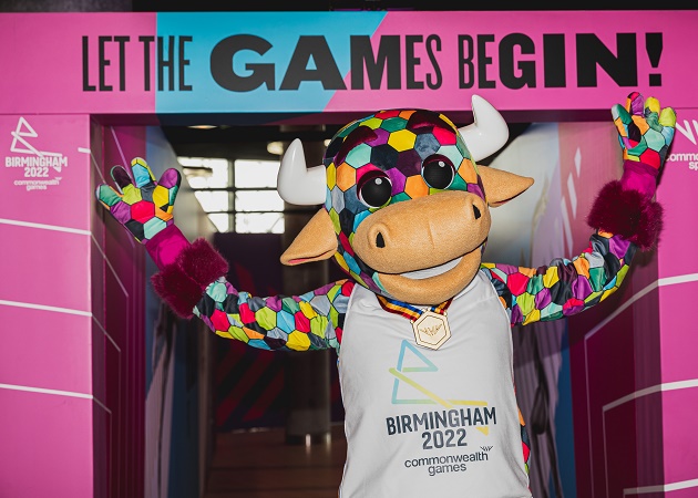 Perry, the Commonwealth Games official mascot, stood beneath a Let the Games begin entrance